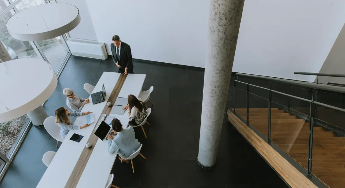 Aerial view at group of business people working together and preparing new project on a meeting in the office